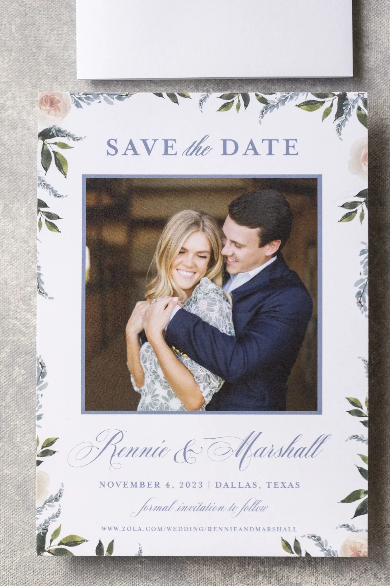 Orr photo save-the-date with a watercolor floral border in soft blue and blush, Dallas, TX